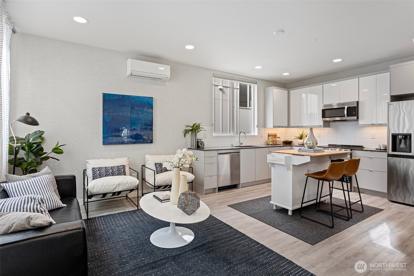 2527 29th Avenue South, Unit D Seattle, WA 98144 - Photo 7 of 20 a living room with furniture kitchen view and a table