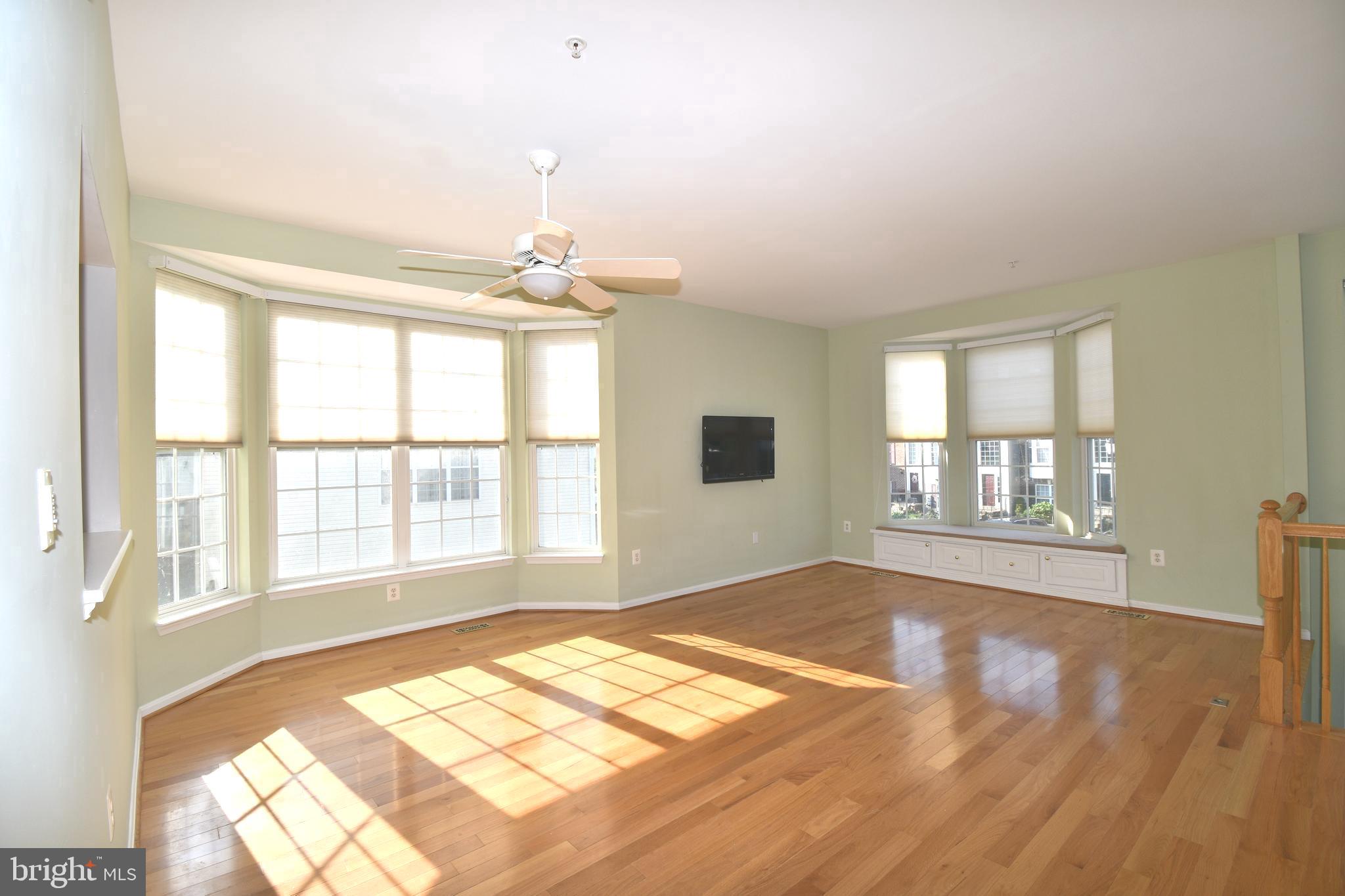 148 Harpers Way Frederick, MD 21702 - Photo 5 of 32 Family room with hardwood floors