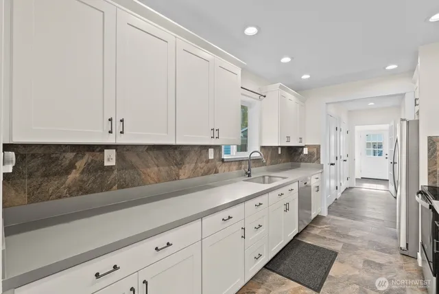 a large kitchen with cabinets