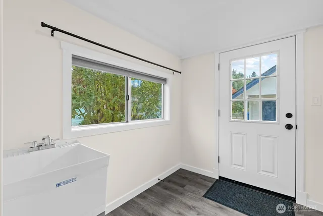 a bathroom with a sink and a window