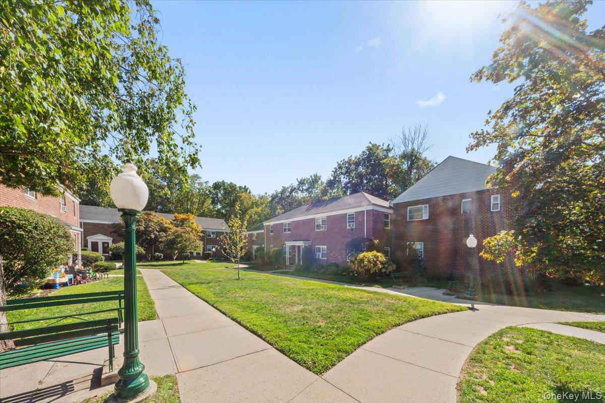470 Tuckahoe Road, Unit 4B Yonkers, NY 10710 - Photo 2 of 17 Surrounding community featuring a lawn and a residential view