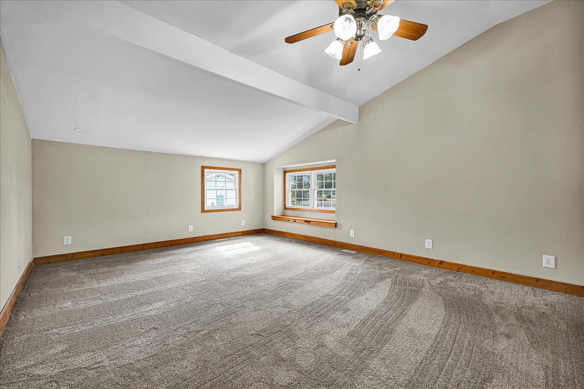 116 Lakeview Road East Galesburg, IL 61430 - Photo 15 of 36 an empty room with chandelier fan and windows