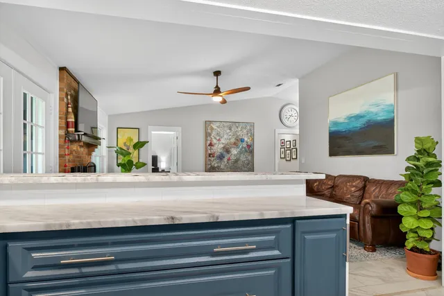 a kitchen with stainless steel appliances granite countertop a stove and a sink