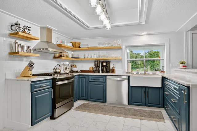 a bedroom with furniture and a chandelier