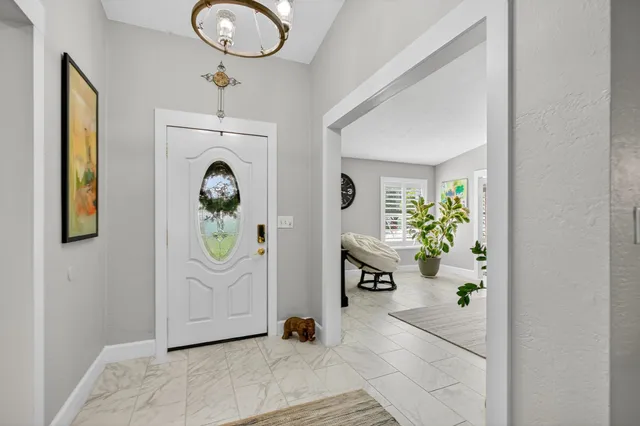a living room with furniture and flowers