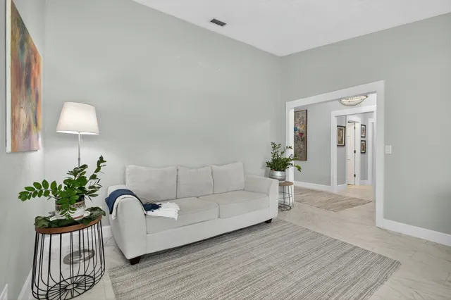 a view of a dining room with furniture and window