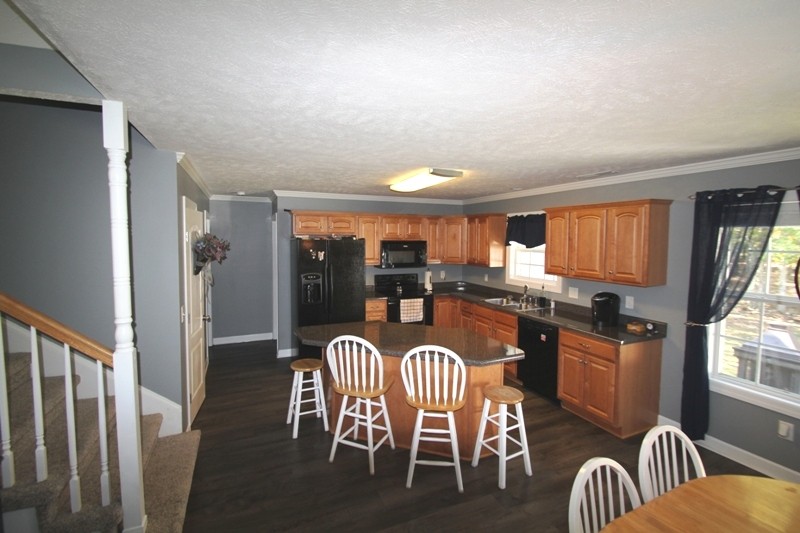 111 Oak Hollow Road Manchester, TN 37355 - Photo 4 of 17 a view of a dining room with furniture window and wooden floor