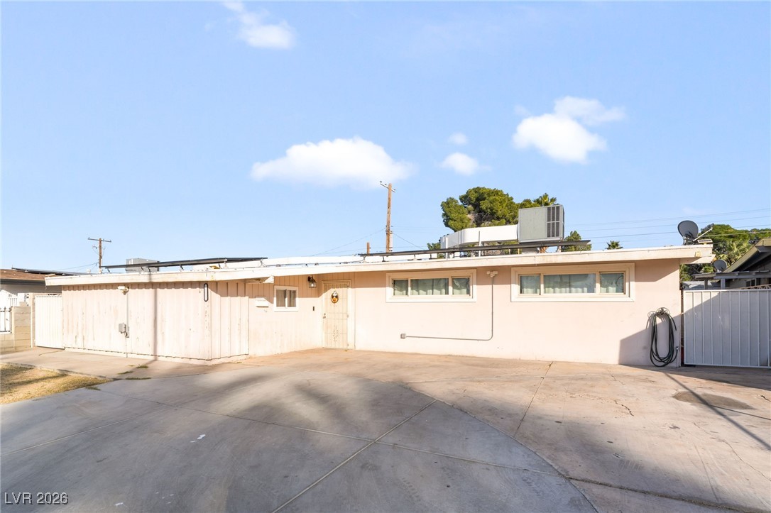 716 North 18th Street Las Vegas, NV 89101 - Photo 2 of 39 Back of property featuring roof mounted solar panels and stucco siding