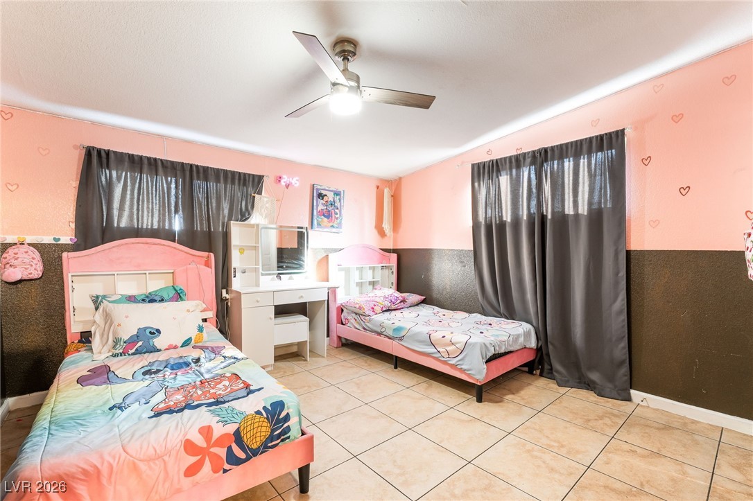 716 North 18th Street Las Vegas, NV 89101 - Photo 22 of 39 Bedroom featuring a ceiling fan and light tile patterned flooring