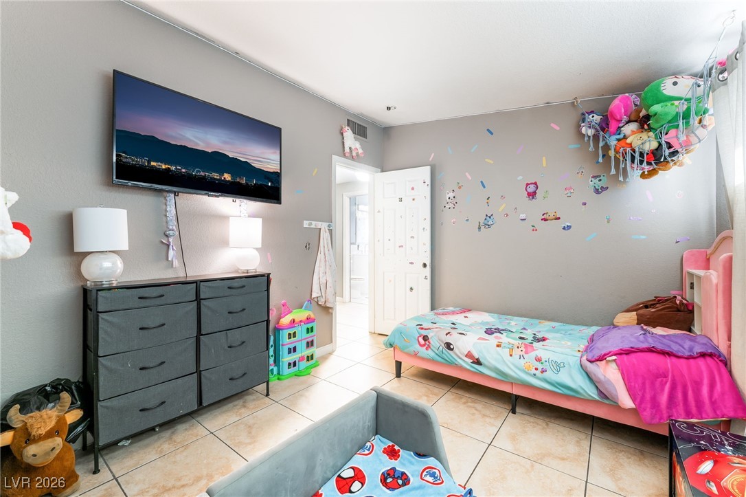 716 North 18th Street Las Vegas, NV 89101 - Photo 29 of 39 Bedroom featuring light tile patterned floors