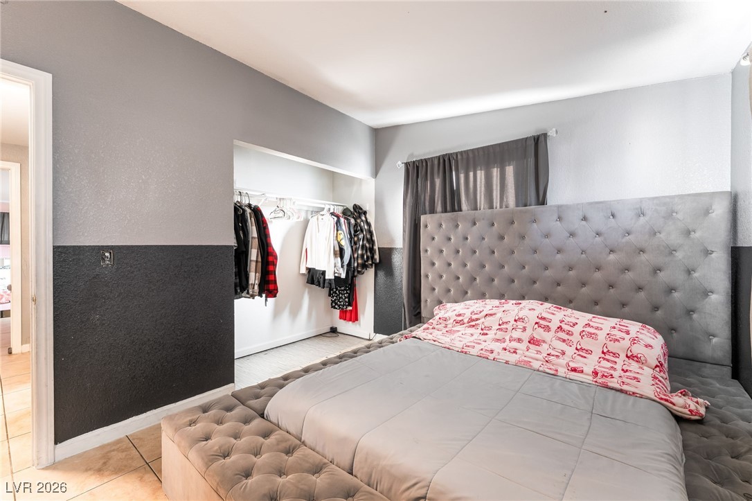 716 North 18th Street Las Vegas, NV 89101 - Photo 32 of 39 Tiled bedroom with a closet and baseboards