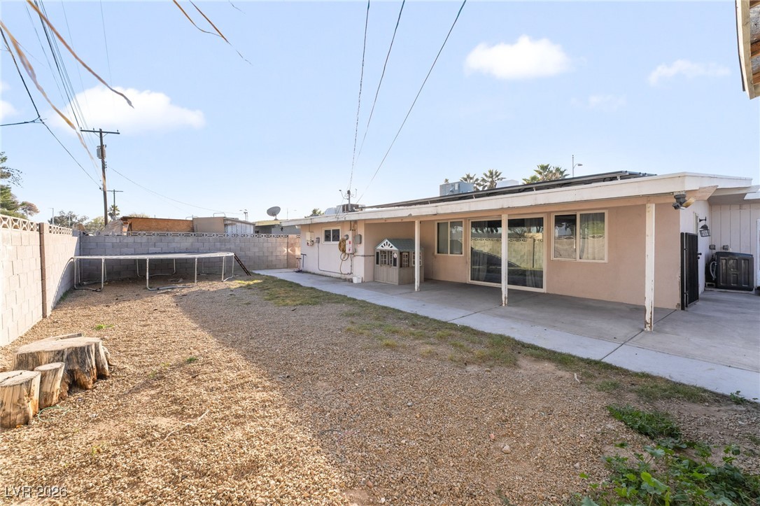 716 North 18th Street Las Vegas, NV 89101 - Photo 37 of 39 Back of property with a patio, a fenced backyard, and stucco siding