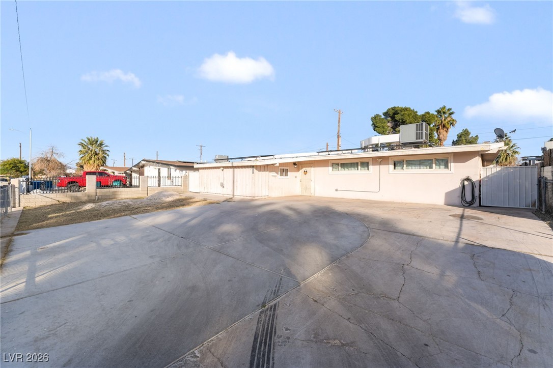 716 North 18th Street Las Vegas, NV 89101 - Photo 4 of 39 View of front of home with a gate and roof mounted solar panels