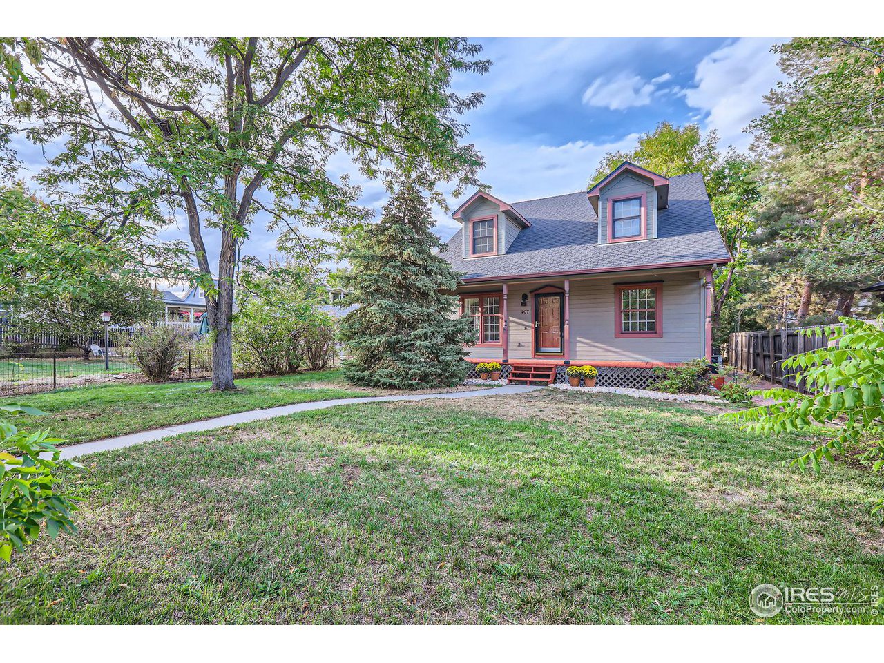 407 East Baseline Road Lafayette, CO 80026 - Photo 1 of 34 a view of a house with a yard potted plants and large tree