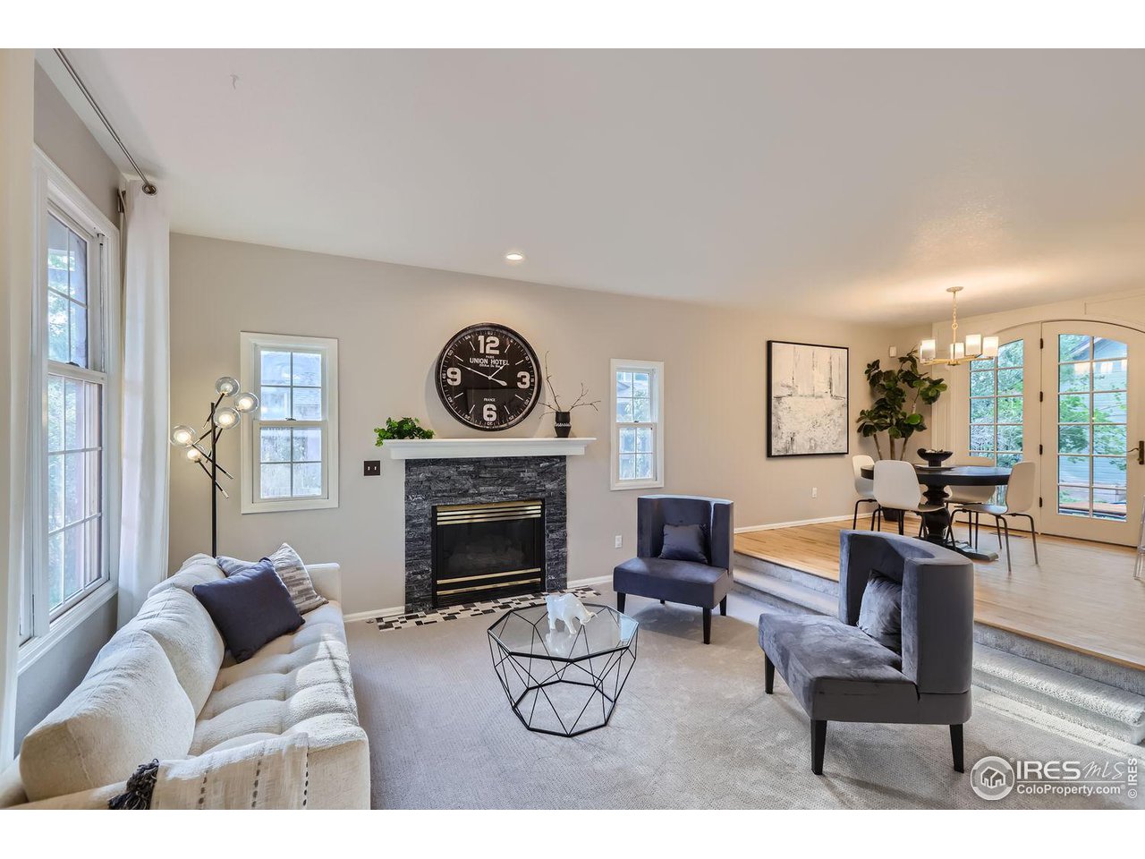 407 East Baseline Road Lafayette, CO 80026 - Photo 2 of 34 a living room with furniture and a fireplace