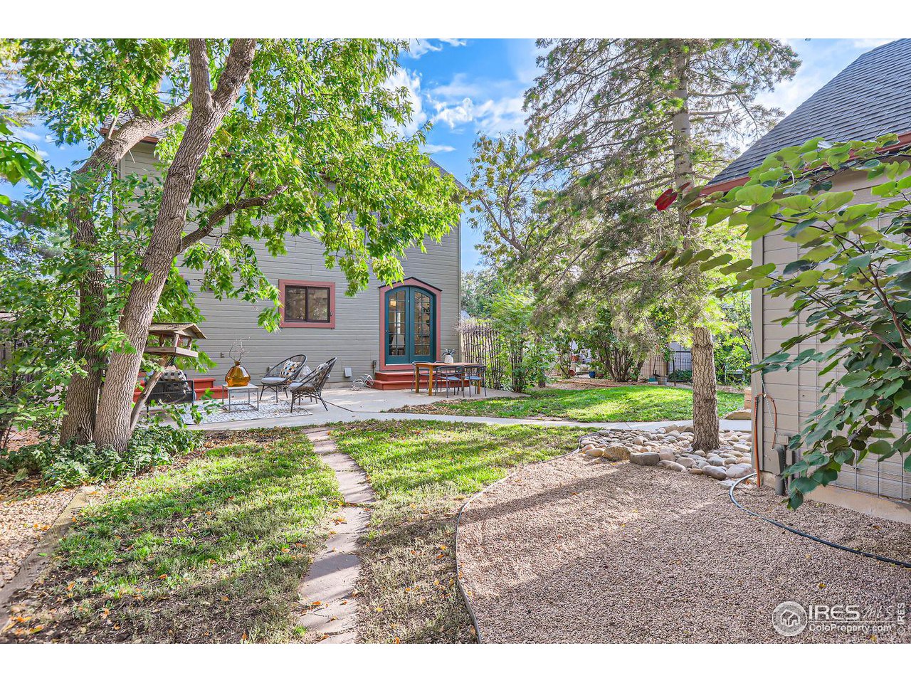 407 East Baseline Road Lafayette, CO 80026 - Photo 25 of 34 a view of a house with backyard porch and sitting area