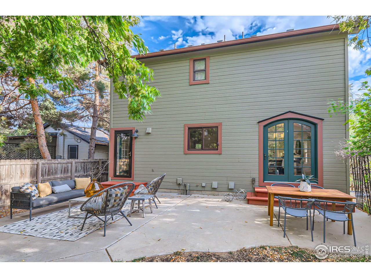 407 East Baseline Road Lafayette, CO 80026 - Photo 26 of 34 a backyard of a house with table and chairs