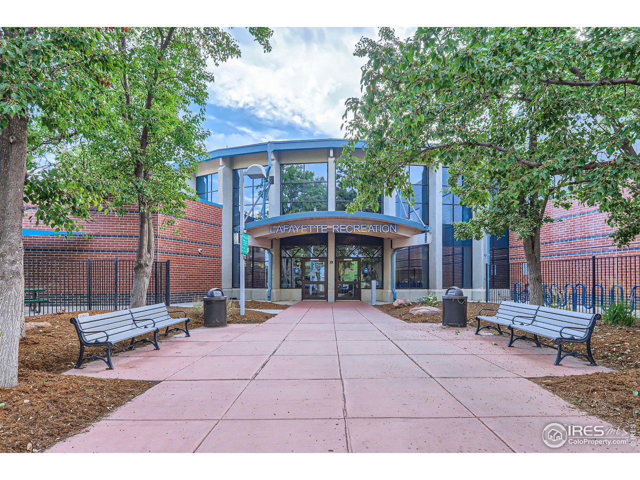 407 East Baseline Road Lafayette, CO 80026 - Photo 28 of 34 a view of a patio with a table and chairs under an umbrella