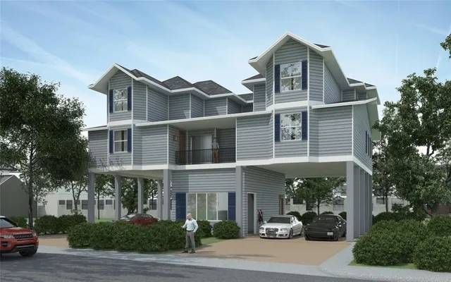 a view of multiple houses with a street