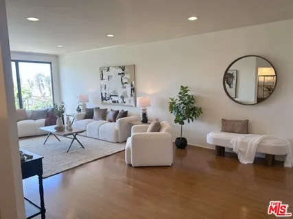 a living room with fireplace furniture and a flat screen tv