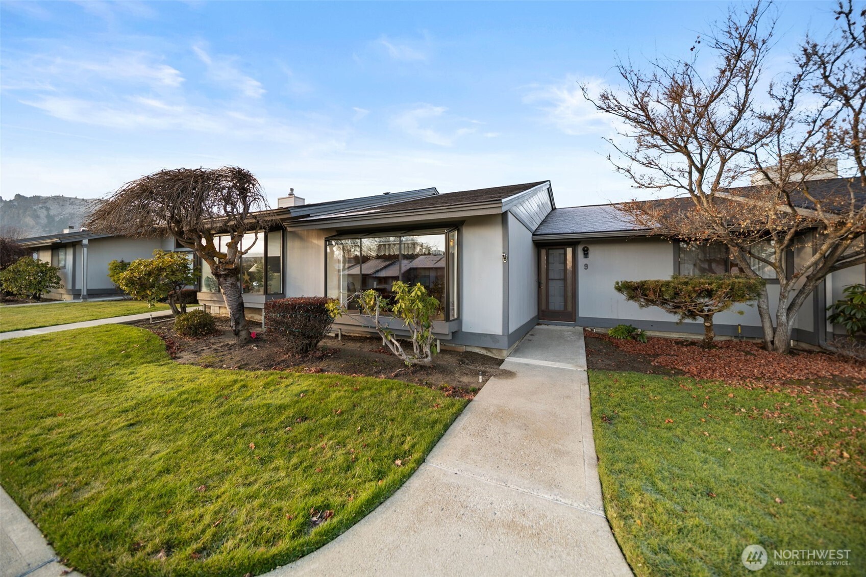 a view of a house with backyard porch and sitting area