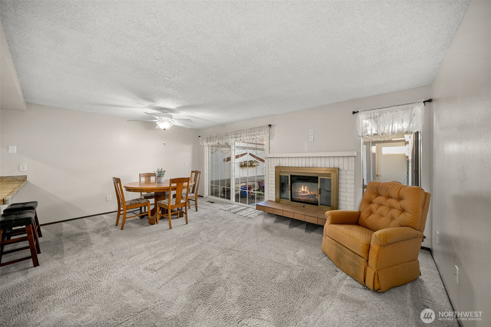 1310 Castlerock Avenue, Unit 9 Wenatchee, WA 98801 - Photo 12 of 33 a living room with furniture and a fireplace