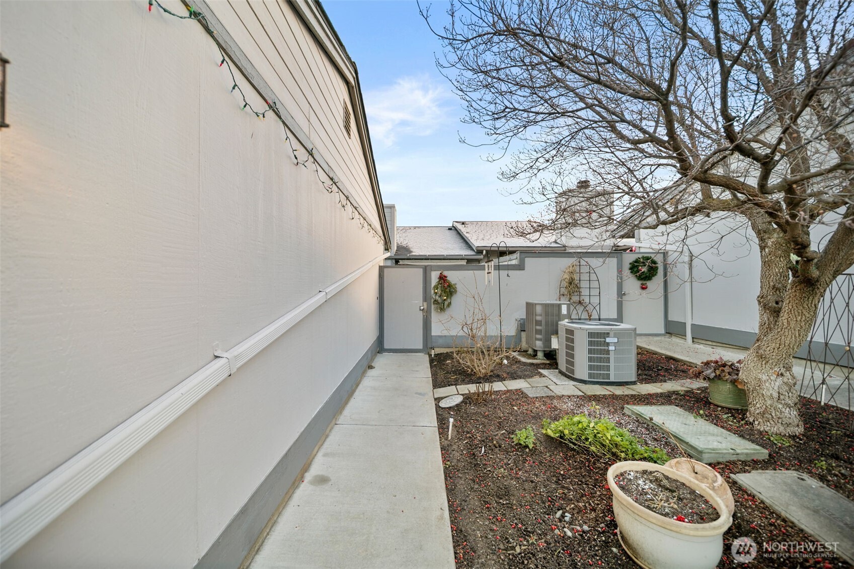 1310 Castlerock Avenue, Unit 9 Wenatchee, WA 98801 - Photo 27 of 33 a view of a house with backyard