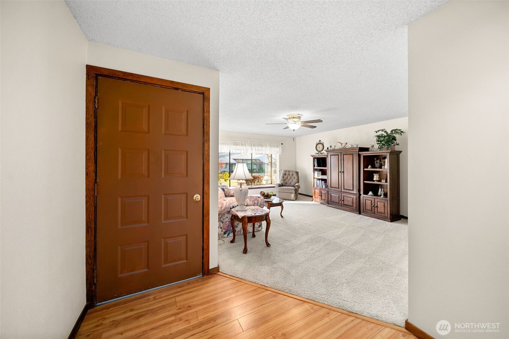 1310 Castlerock Avenue, Unit 9 Wenatchee, WA 98801 - Photo 3 of 33 a view of a livingroom with furniture and an entryway