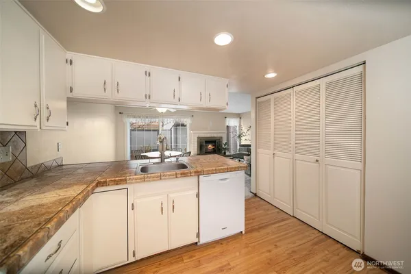 a kitchen with a stove a sink and a refrigerator