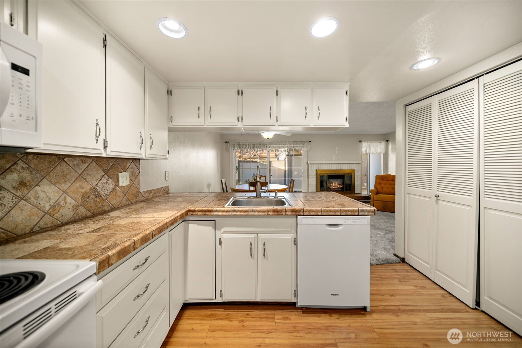 1310 Castlerock Avenue, Unit 9 Wenatchee, WA 98801 - Photo 7 of 33 a kitchen with stainless steel appliances granite countertop a sink and cabinets