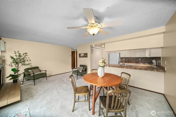 a kitchen with a table and chairs in it
