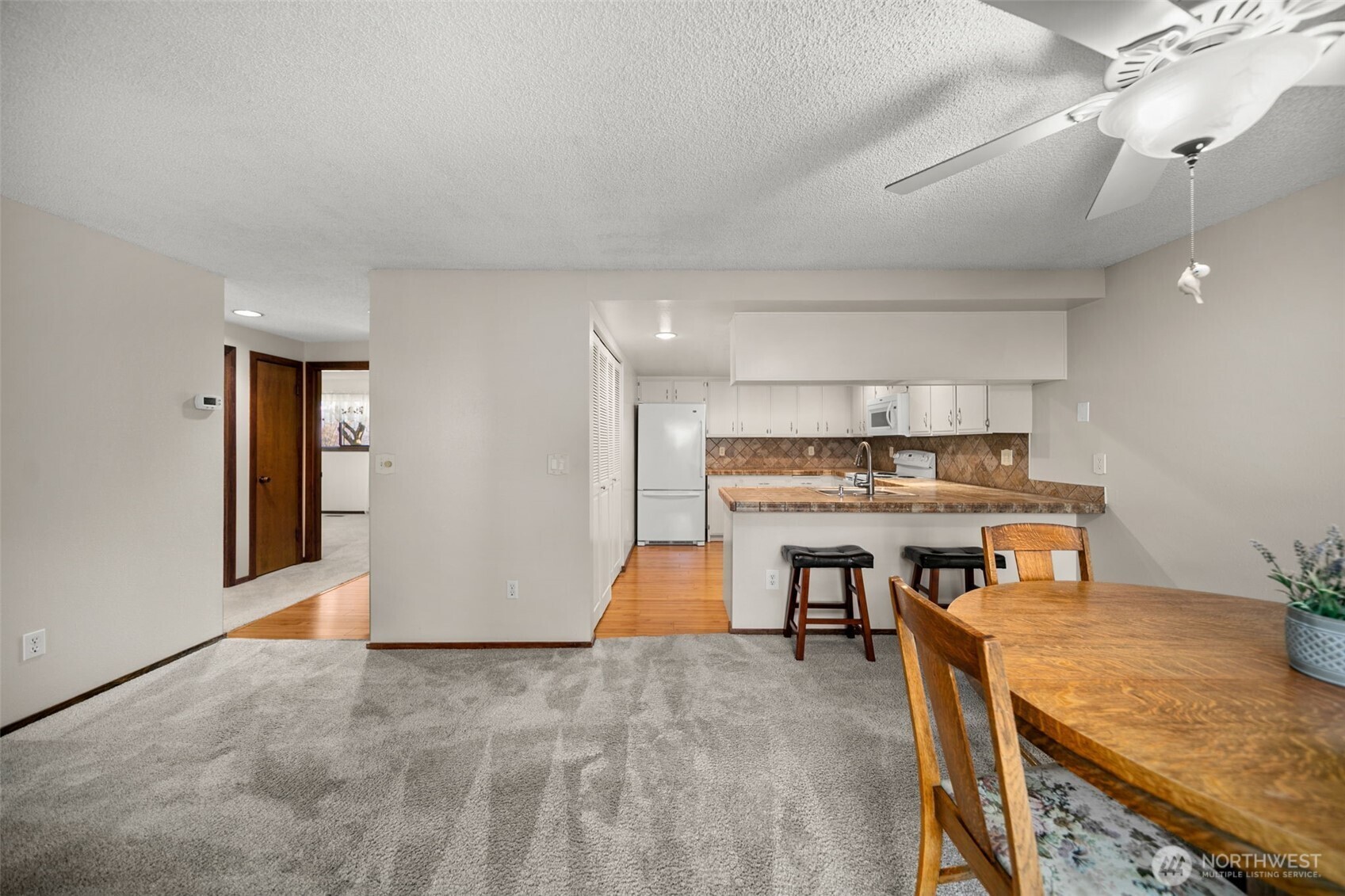 1310 Castlerock Avenue, Unit 9 Wenatchee, WA 98801 - Photo 10 of 33 a room with furniture and kitchen view