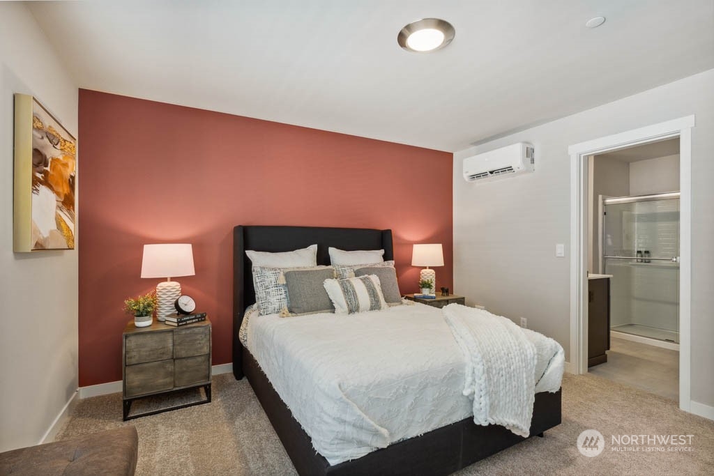 9614 19th Avenue Southeast, Unit E Everett, WA 98208 - Photo 12 of 17 a bedroom with a bed and a lamp