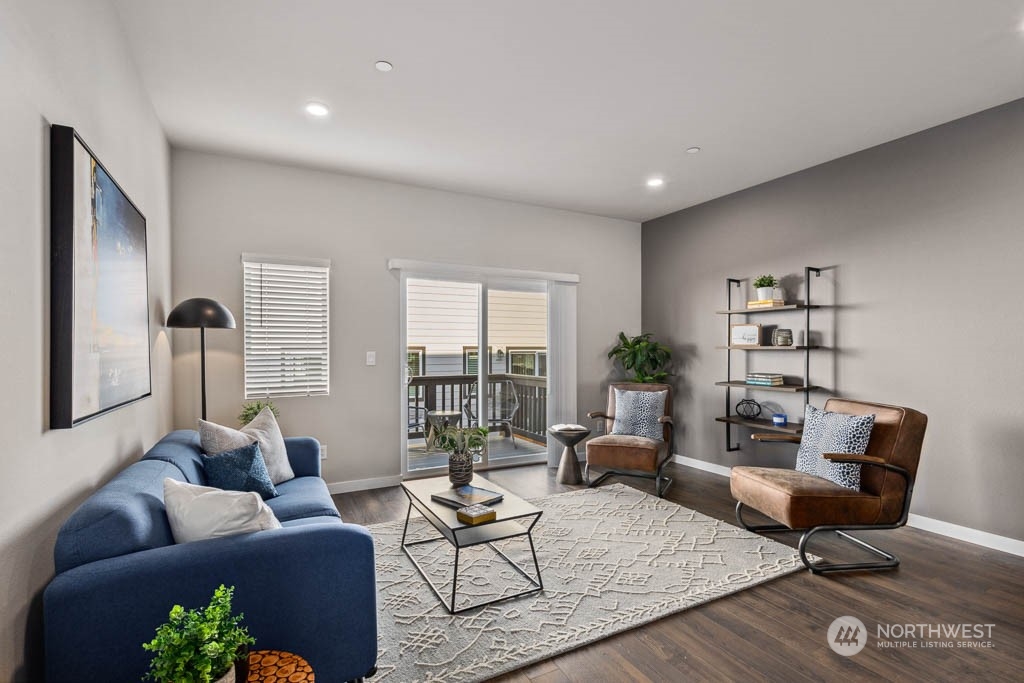 9614 19th Avenue Southeast, Unit E Everett, WA 98208 - Photo 2 of 17 a living room with furniture and wooden floor