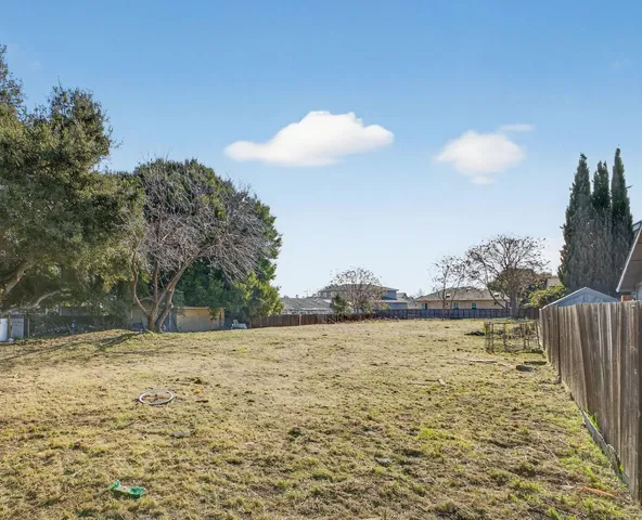 a view of a yard with an ocean view