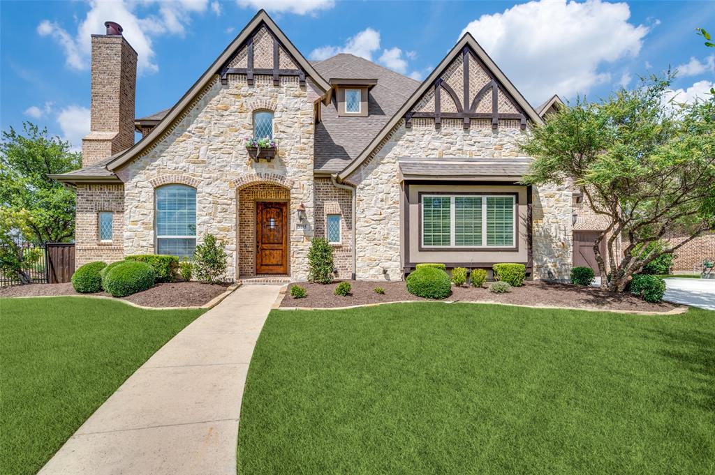 3105 Callander The Colony, TX 75056 - Photo 1 of 1 a front view of a house with a yard and potted plants