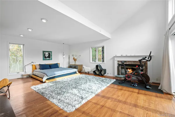 a living room with furniture pool table and a fireplace