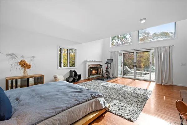 a bedroom with a bed and a fireplace