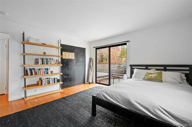 a bed room with a bed and a book shelf
