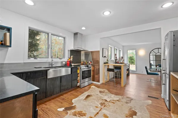 a kitchen with lots of counter top space and stainless steel appliances