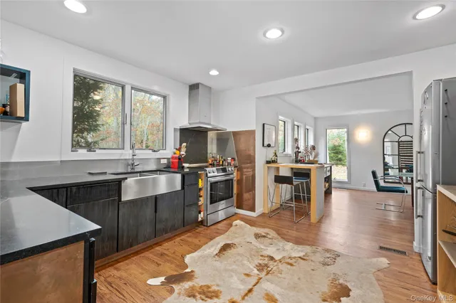 a kitchen with lots of counter top space and stainless steel appliances