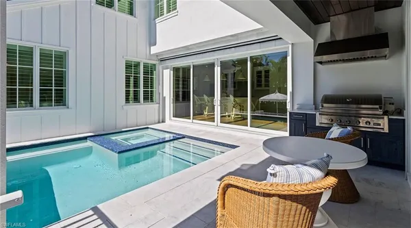 a outdoor living space with furniture and a fireplace