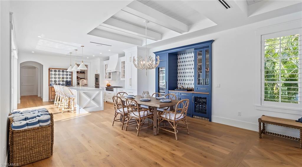 844 8th Street South Naples, FL 34102 - Photo 8 of 13 a dining room with furniture and wooden floor