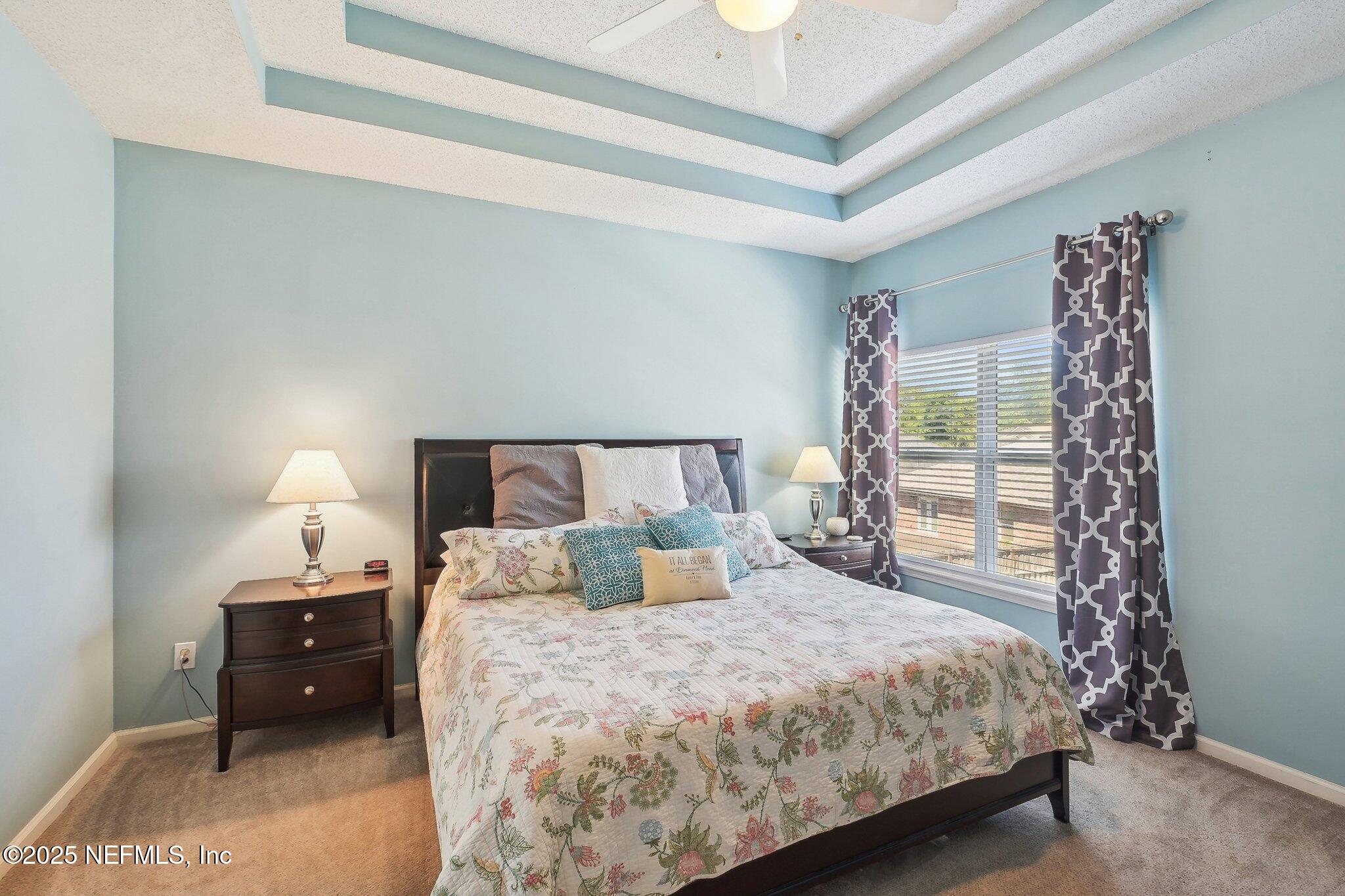 12529 Cliffrose Trail Jacksonville, FL 32225 - Photo 16 of 23 a bedroom with a bed and a window