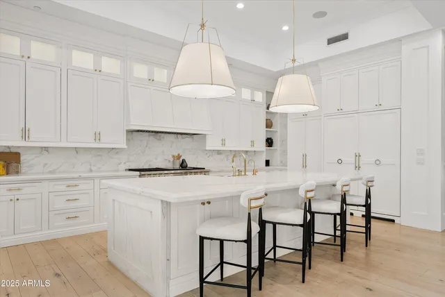 a large en suite bathroom with a shower sink and mirror