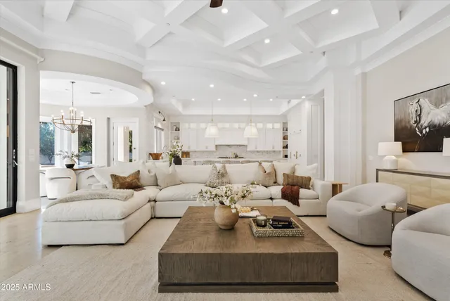 a view of an empty room with a flat screen tv and a window