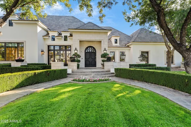 a front view of a house with garden