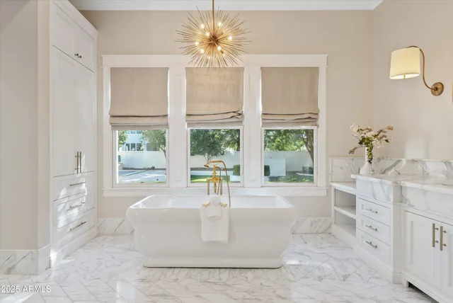 a bathroom with a sink a mirror and a shower