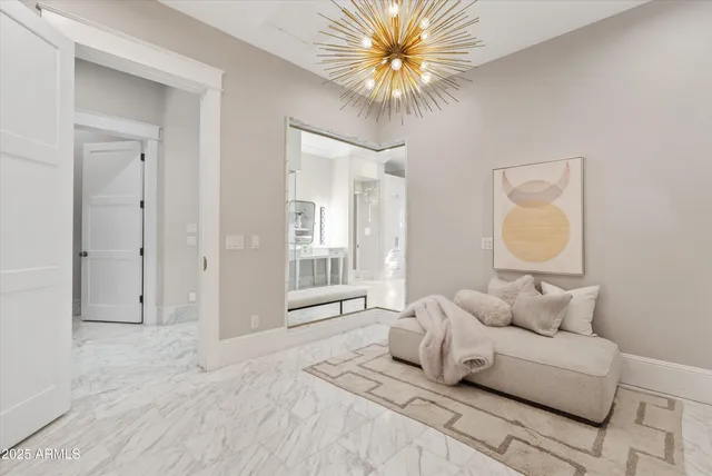 a front view of a house with a yard table and seating