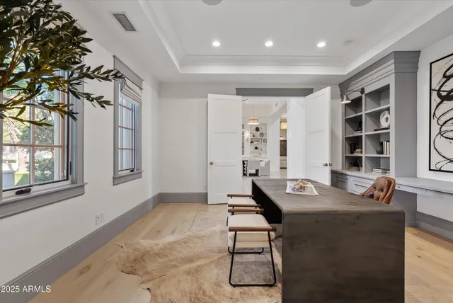 a front view of a house with garden and patio